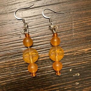Handmade orange sun face drop earrings